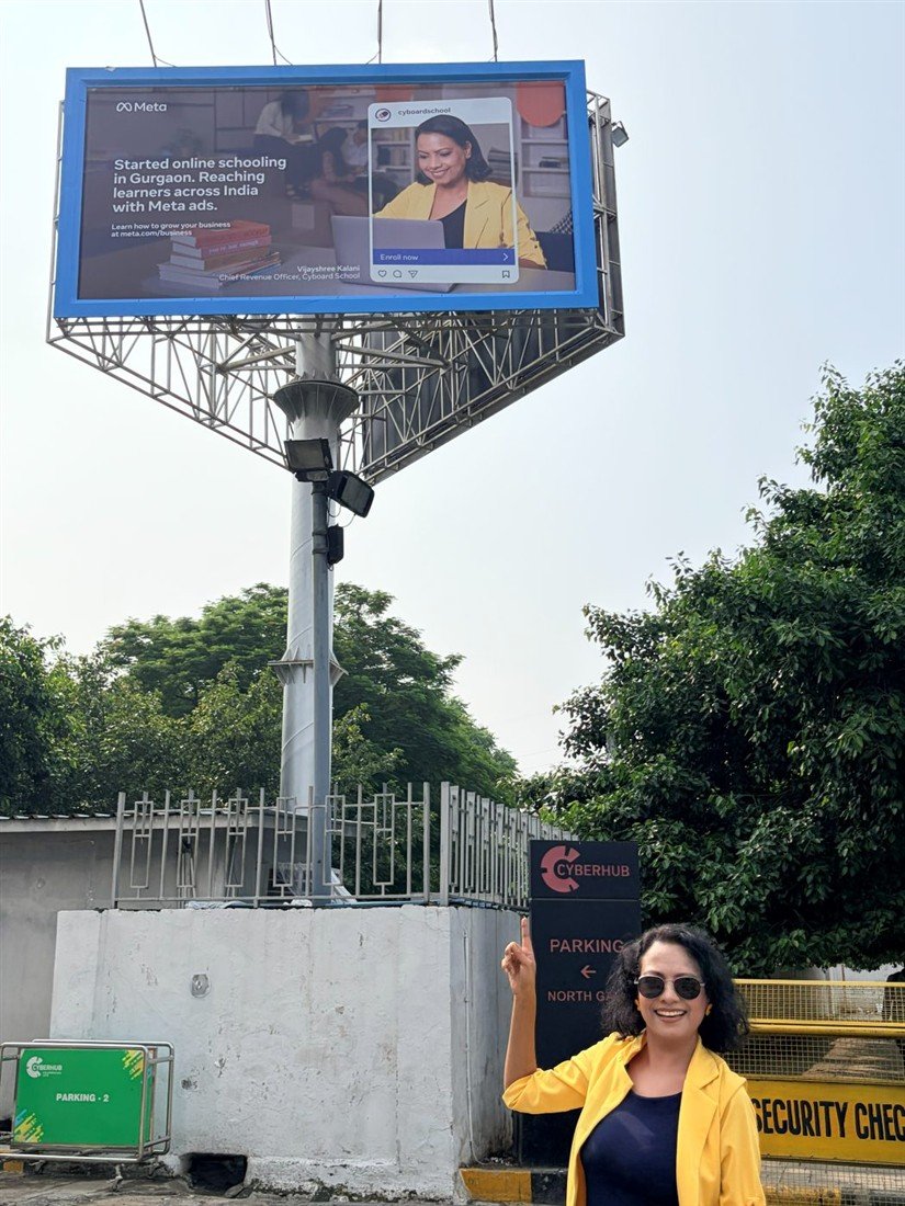 Vijayshree Kalani beneath her billboard